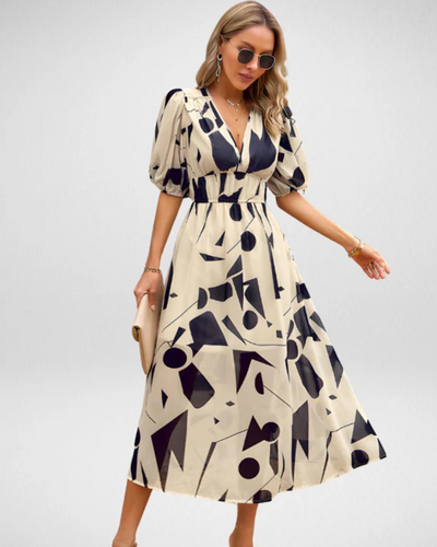 ABBY™ | VESTIDO ELEGANTE CON ESCOTE EN V Y MOTIVOS VIBRANTES