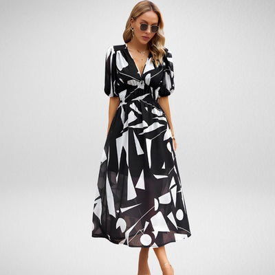 ABBY™ | VESTIDO ELEGANTE CON ESCOTE EN V Y MOTIVOS VIBRANTES